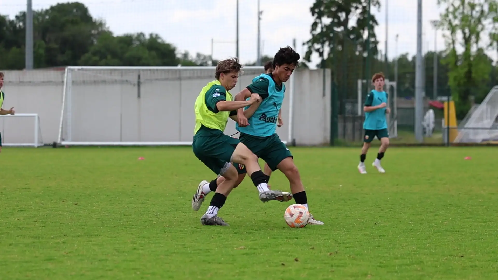 Two players challenging for the ball